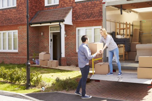 Movers carefully handling furniture