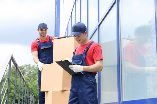 Professional Man and Van team loading a van for a move in Reigate