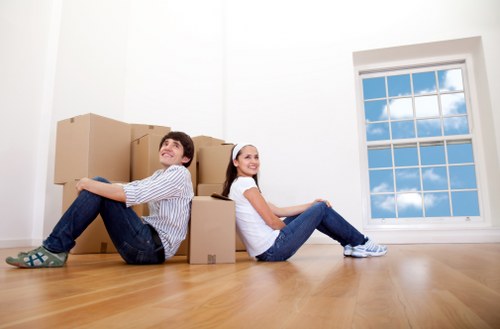 Professional movers handling boxes in Leyton