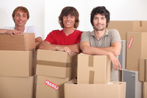 Friendly movers handling furniture during a relocation in Baldock