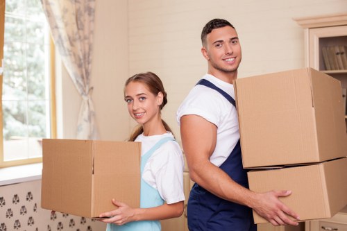 Movers assisting in unpacking at a new home in Amersham