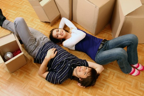 Professional movers loading belongings into a van for removal in Hitchin.